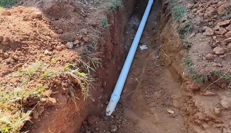 Plumbing technician working on visible pipe connections for Sewer Line Repair in Tolleson, AZ in Original Tolleson