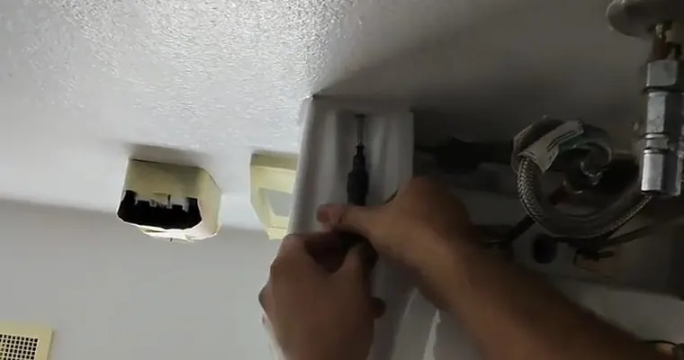 Sink faucet and drain connection being adjusted under a cabinet for Faucet and Fixture Repair in Tolleson, AZ The connection details are easier to see here.