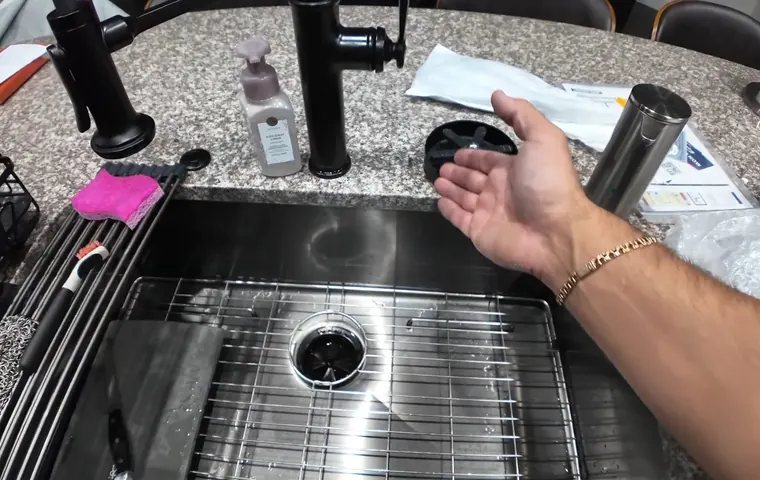 Sink faucet and drain connection being adjusted under a cabinet for Plumber Serving Litchfield Park, AZ in Tolleson