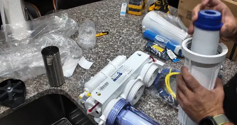 Under-sink reverse osmosis filter system and dedicated faucet parts for Water Softener vs Reverse Osmosis in Tolleson, AZ: Which Does Your Home Need? The repair area is visible from a closer angle.