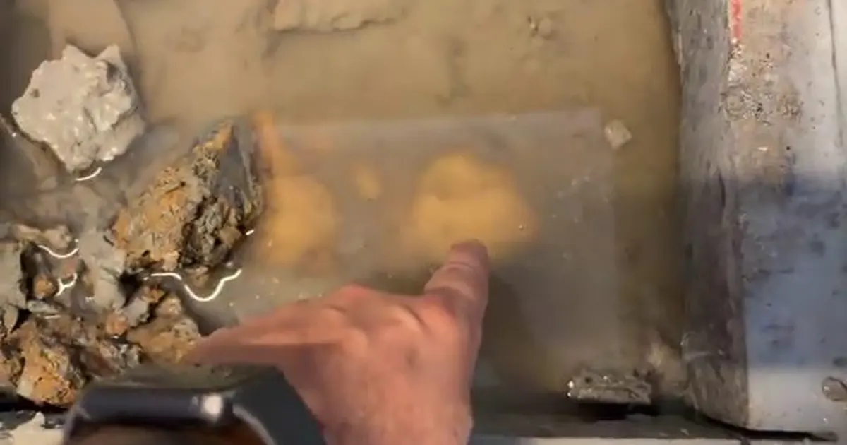 Under-slab plumbing repair area with concrete or soil opened for Caliche Soil and Hard Water: Why Slab Leaks Are More Common in Tolleson in Original Tolleson